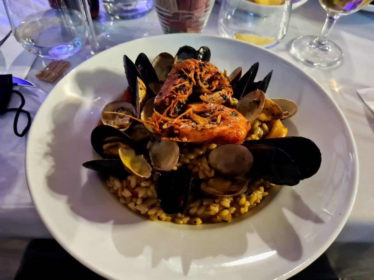 Seafood with mussels, clams and prawns on a bed of fregola